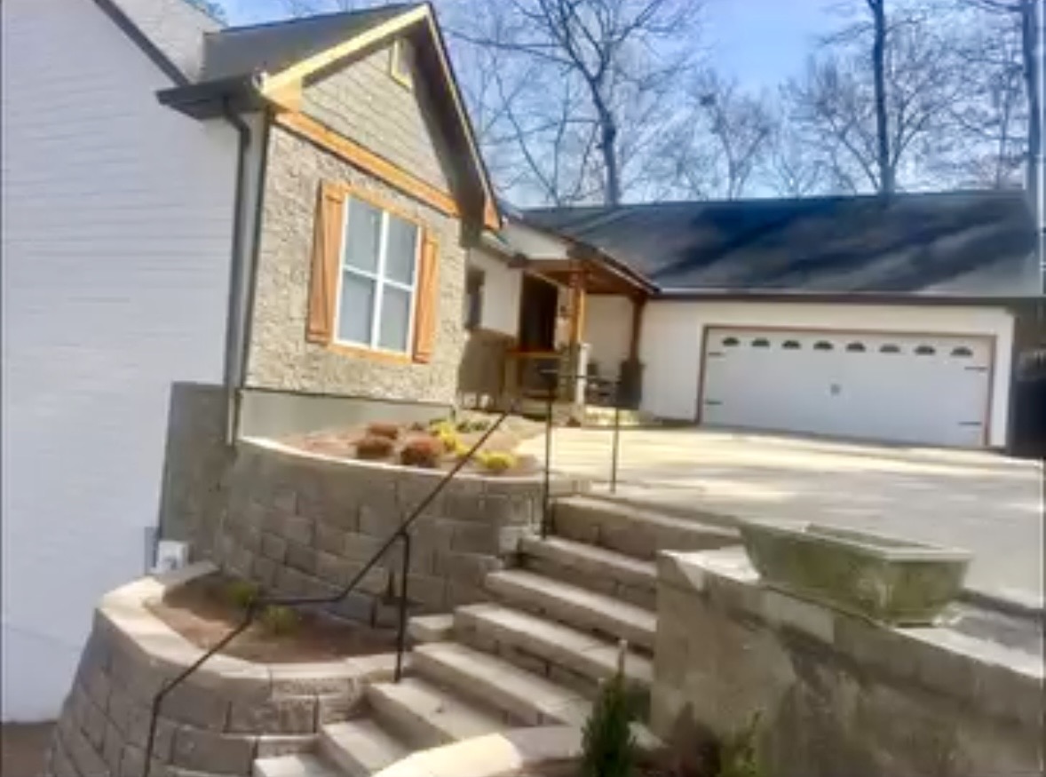 Terraced walls, steps and handrails at a front entry